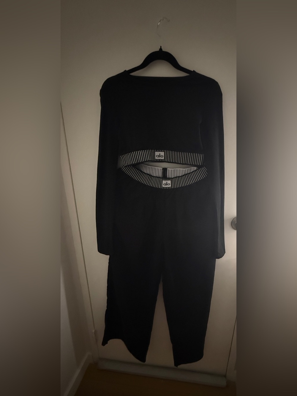 Black Long-Sleeve Jumpsuit with Striped Waist Detail